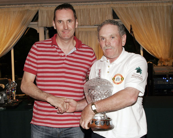 Eamon Daly receiving the Condon brothers' memorial trophy
